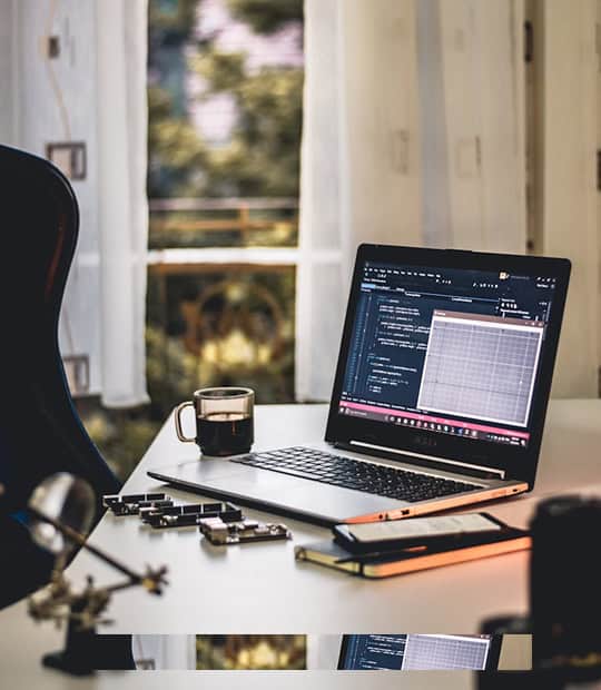 A laptop on a table.